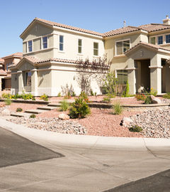 Residential Las Vegas home with front entry landscaping and desert plants, LivingWaterLV