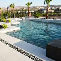Stunning modern pool design with pristine water and elegant landscaping
