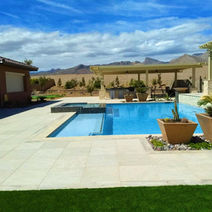 Stunning pool and landscape design with mountain views in the background