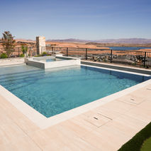 Modern swimming pool with hot tub, beautiful views, and outdoor pool landscaping LivingWaterLV