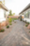Stone walkway leads through the landscaping and backyard. Pavers and Landscaping, LivingWaterLV.