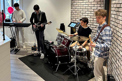 Live musicians performing at a Wallace Center community event.