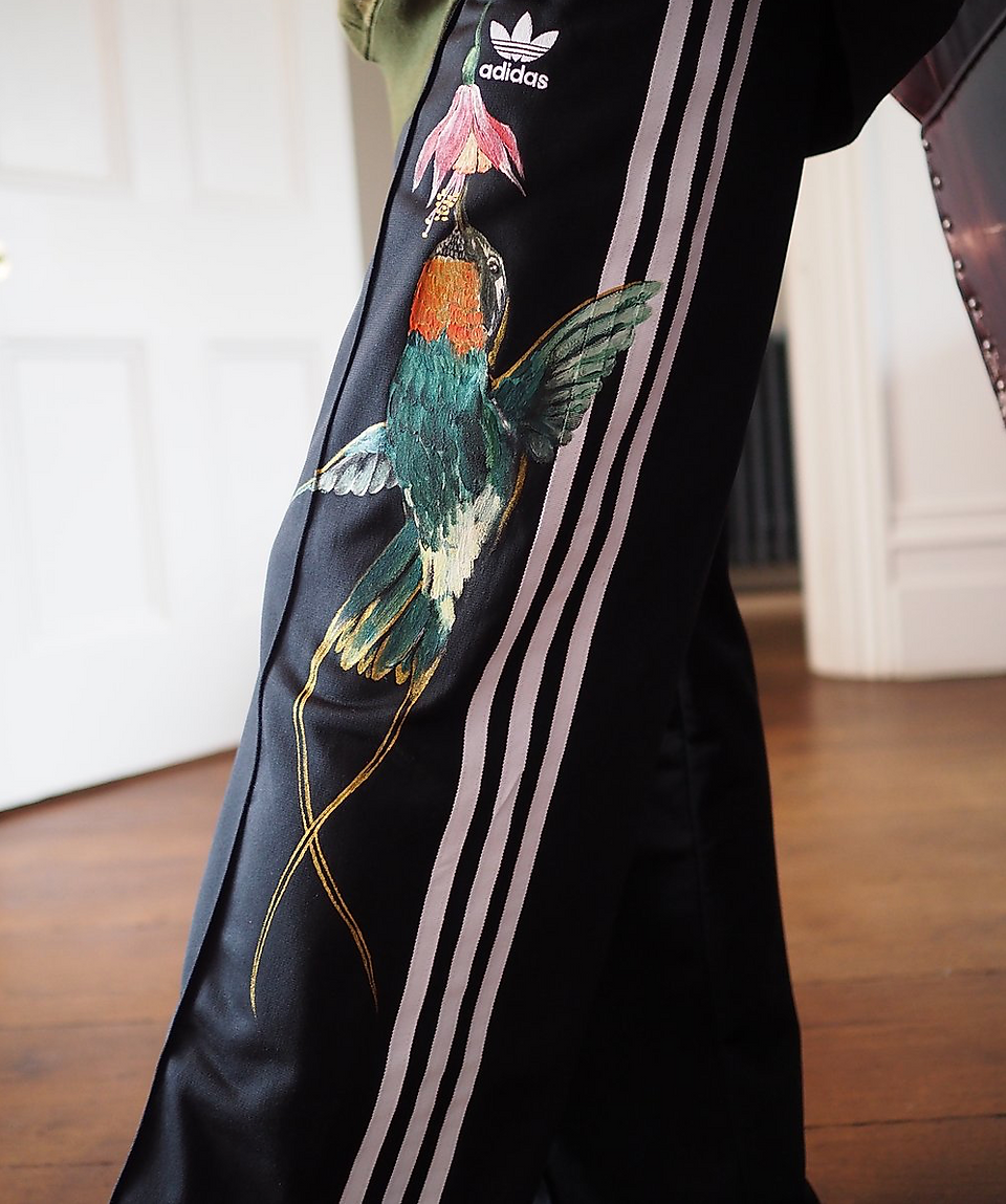 Daughter of a Bohemian doctor bird hand painted Adidas track trousers