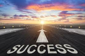 highway into the distance with the word Success and an arrow pointing to the future