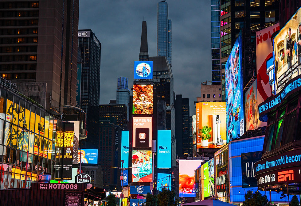 Illuminated billboards and advertisements in Times Square, New York City at night.