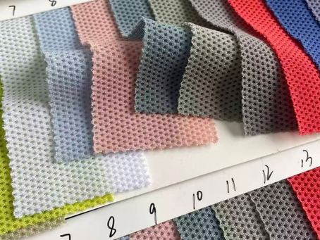 Sportswear performance fabric swatches from XMT fabric partners