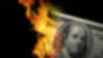 One hundred dollar bill on fire.