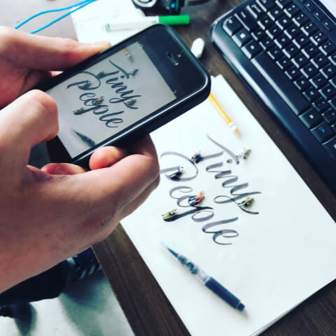 Typography design and “Find People” concept on paper and phone