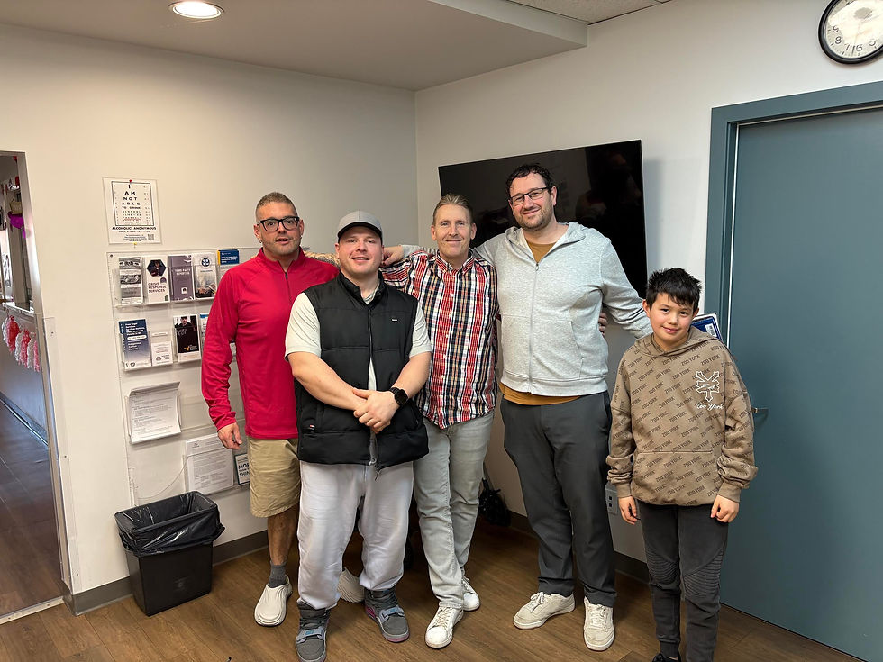 Four men and a boy standing taking a picture they are the four directors for Into the Light Society.