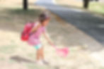 Girl catching bugs with a net