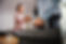Woman shaking hands with a repairman while standing at home..jpg
