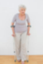 full-length-senior-woman-with-crutches