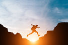 man-jump-through-gaps-hills.jpg