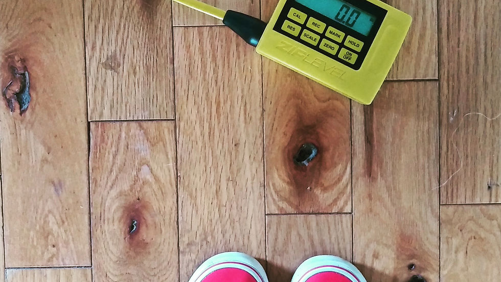 Eye-level view of a homeowner discussing foundation assessment results with an inspector