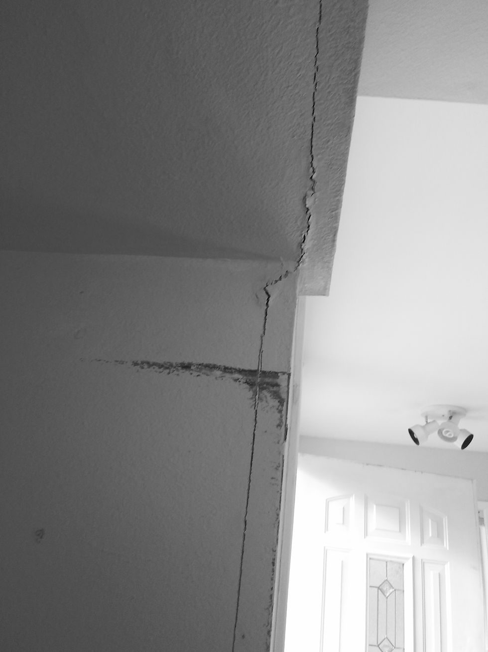 Drywall cracks noticed near a laundry room.
