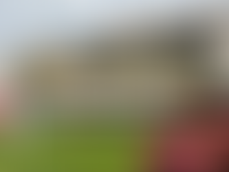 Welcoming family home in Woodbridge, VA with lush landscaping and waterfront scenery, illustrating affordable home buying options for buyers with a 620 credit score in 2025.