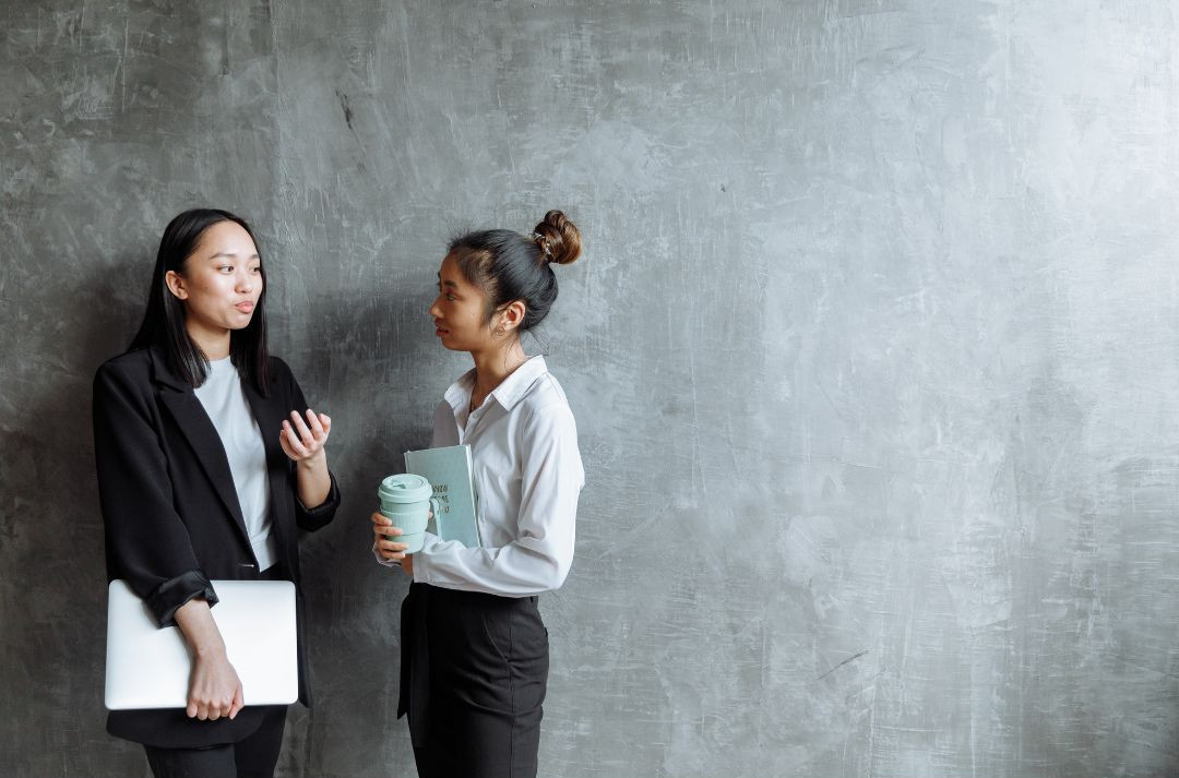 Teen having a conversation and explaining her point to another person.
