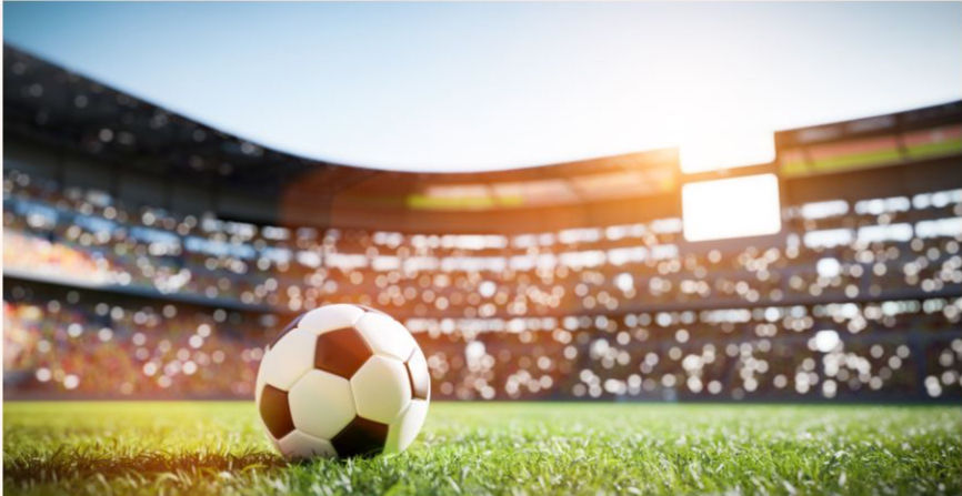 Soccer ball on the field of a packed stadium, symbolizing how teens can go all out—joining competitions, pursuing big opportunities, and turning passions into real-world experiences that stand out in college applications.