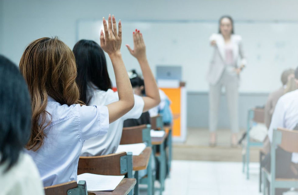 high school student raising hand in class building confidence and participation