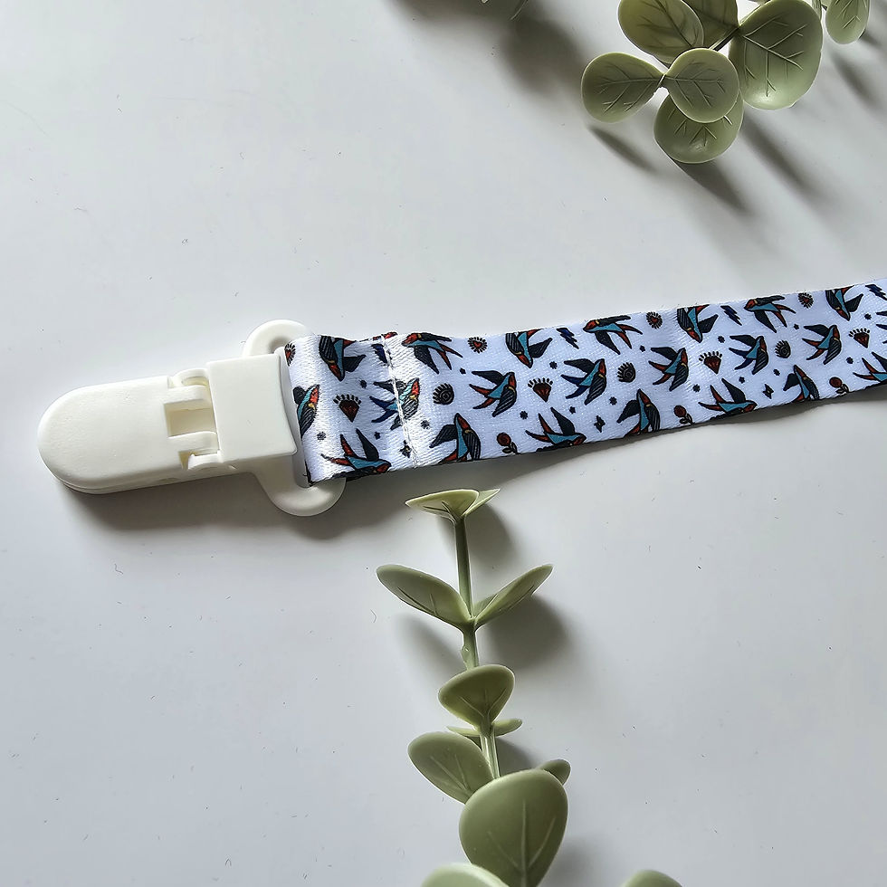 Thumbnail: Attache-suce en tissus pour bébé aux motifs originale