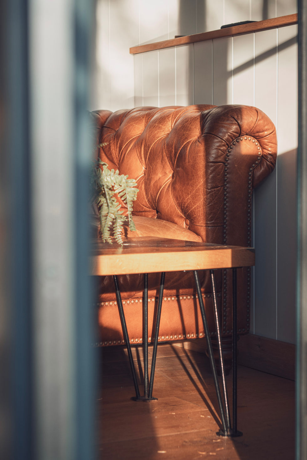 A luxury lifestyle photograph highlighting the landscape, accommodation, and calm atmosphere of a country resort. The image showcases the experience through soft lighting, thoughtful composition, and a relaxed, high-end aesthetic.
