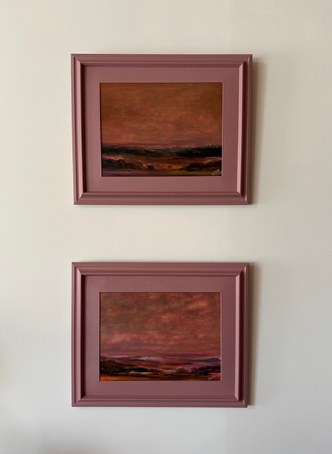 two framed paintings on a wall