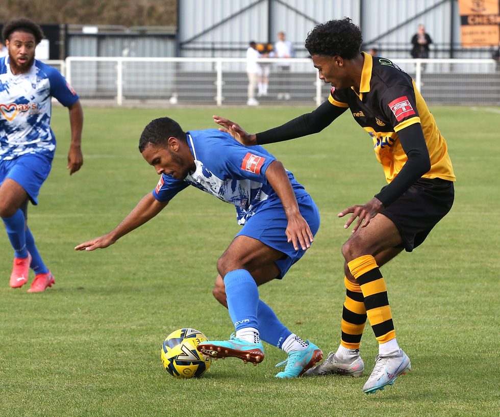 Zack Newton shields the ball vs Cheshunt A 23/24