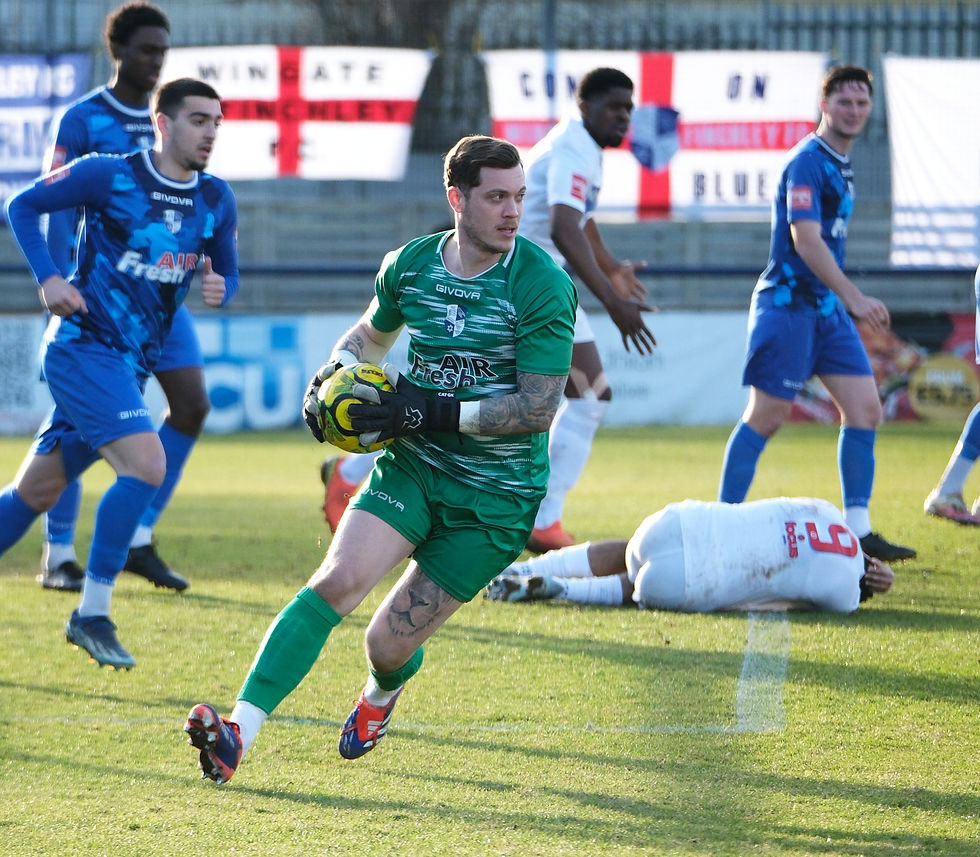 Charlie Grainger holds the ball vs Whitehawk H 24/25