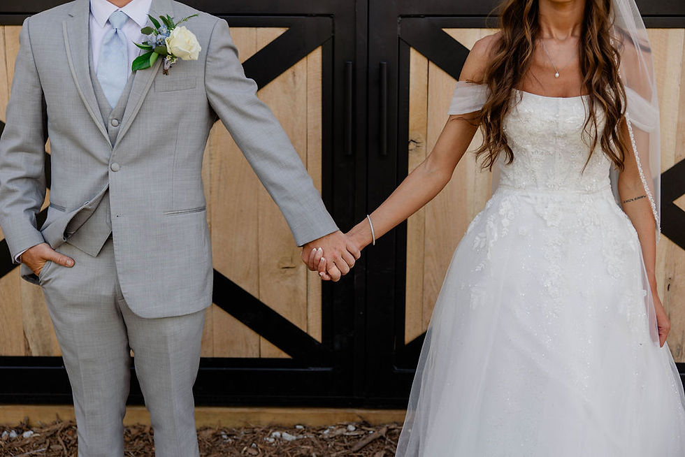 Couple in front of SpringHaus Farm barn Athens, GA