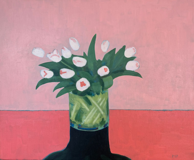 Vase of tulips on pink background