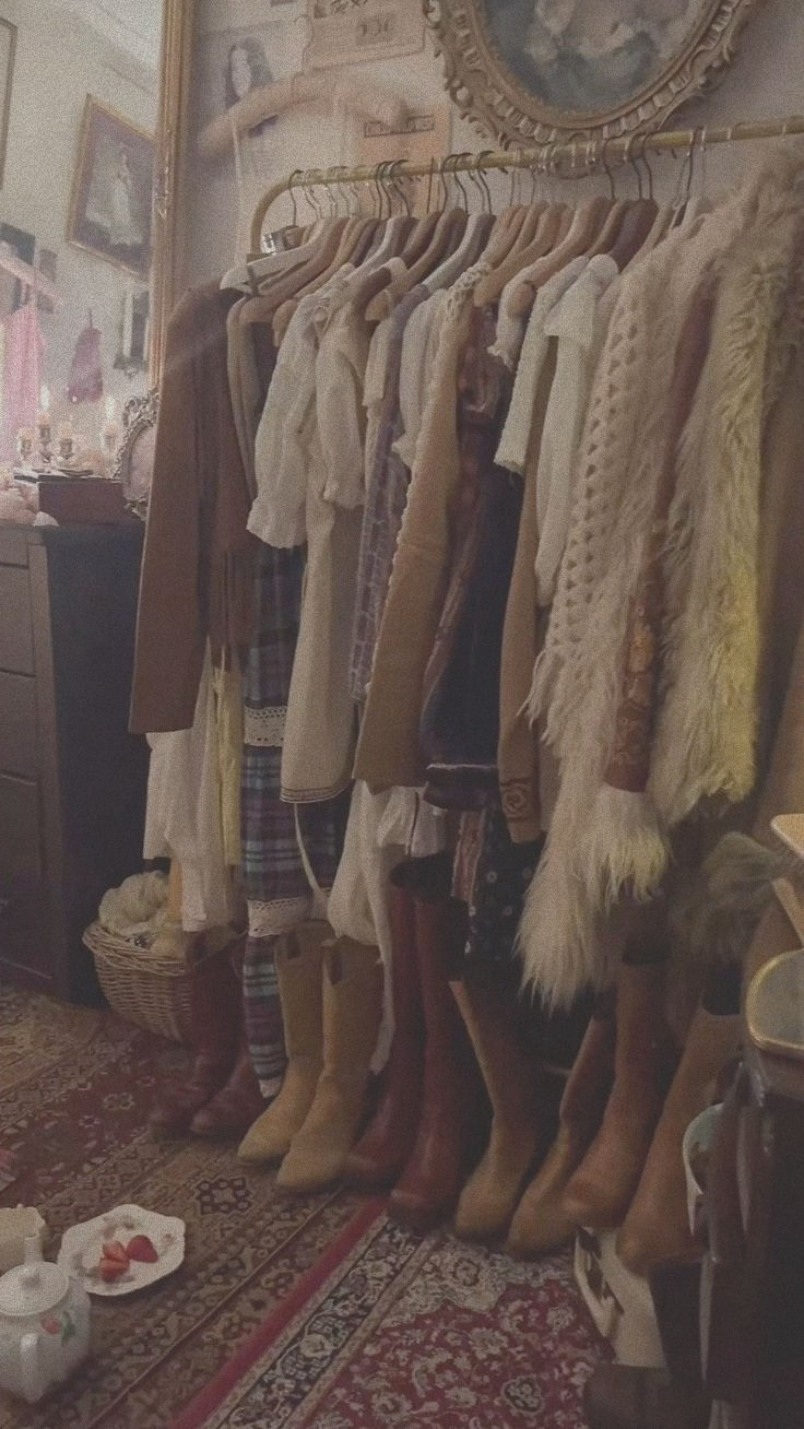 Neutral clothing hanging neatly on a wardrobe rack for intentional everyday style.