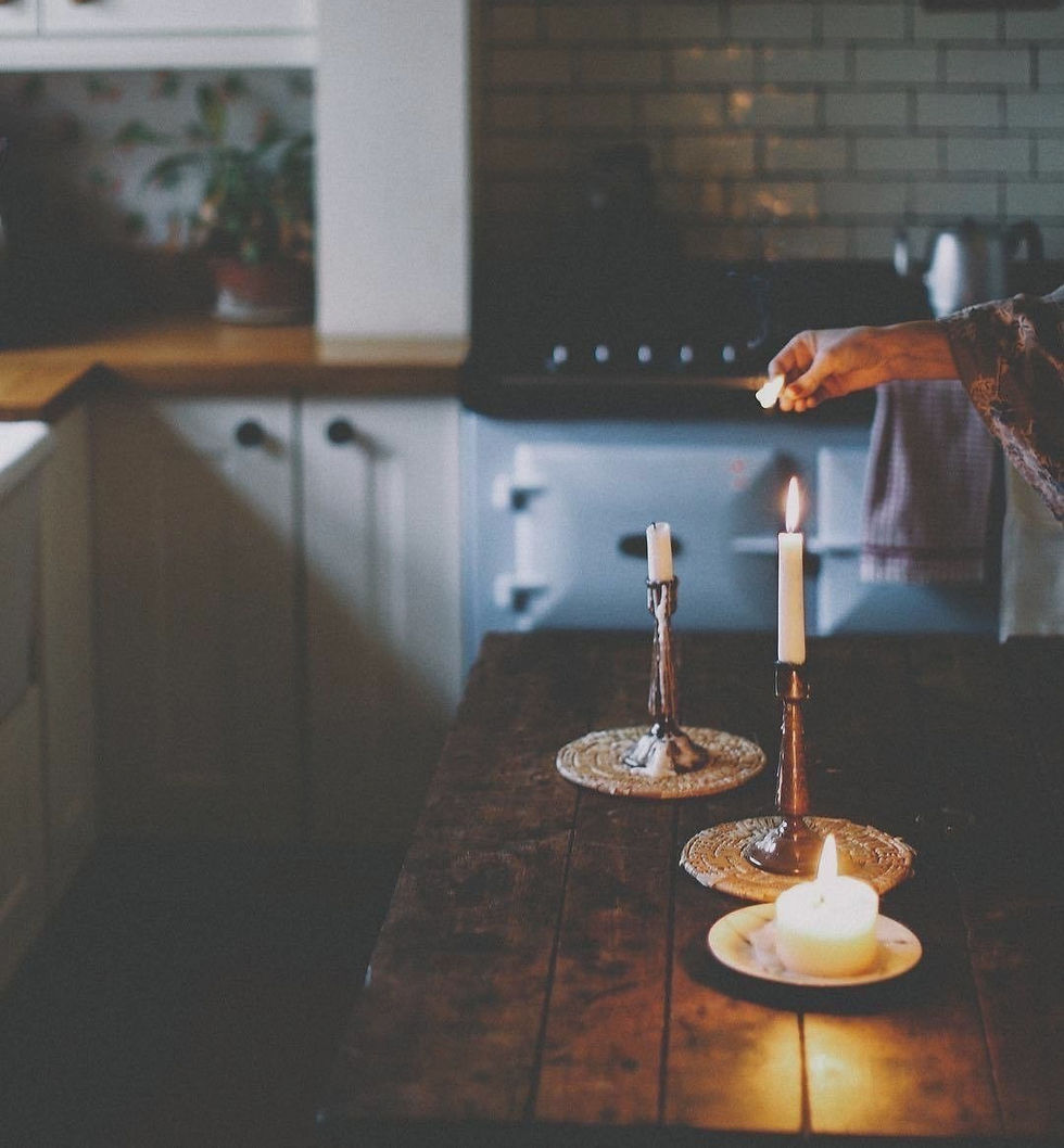 Morning coffee beside a candle warmer in a cozy kitchen creating a peaceful start to the day.