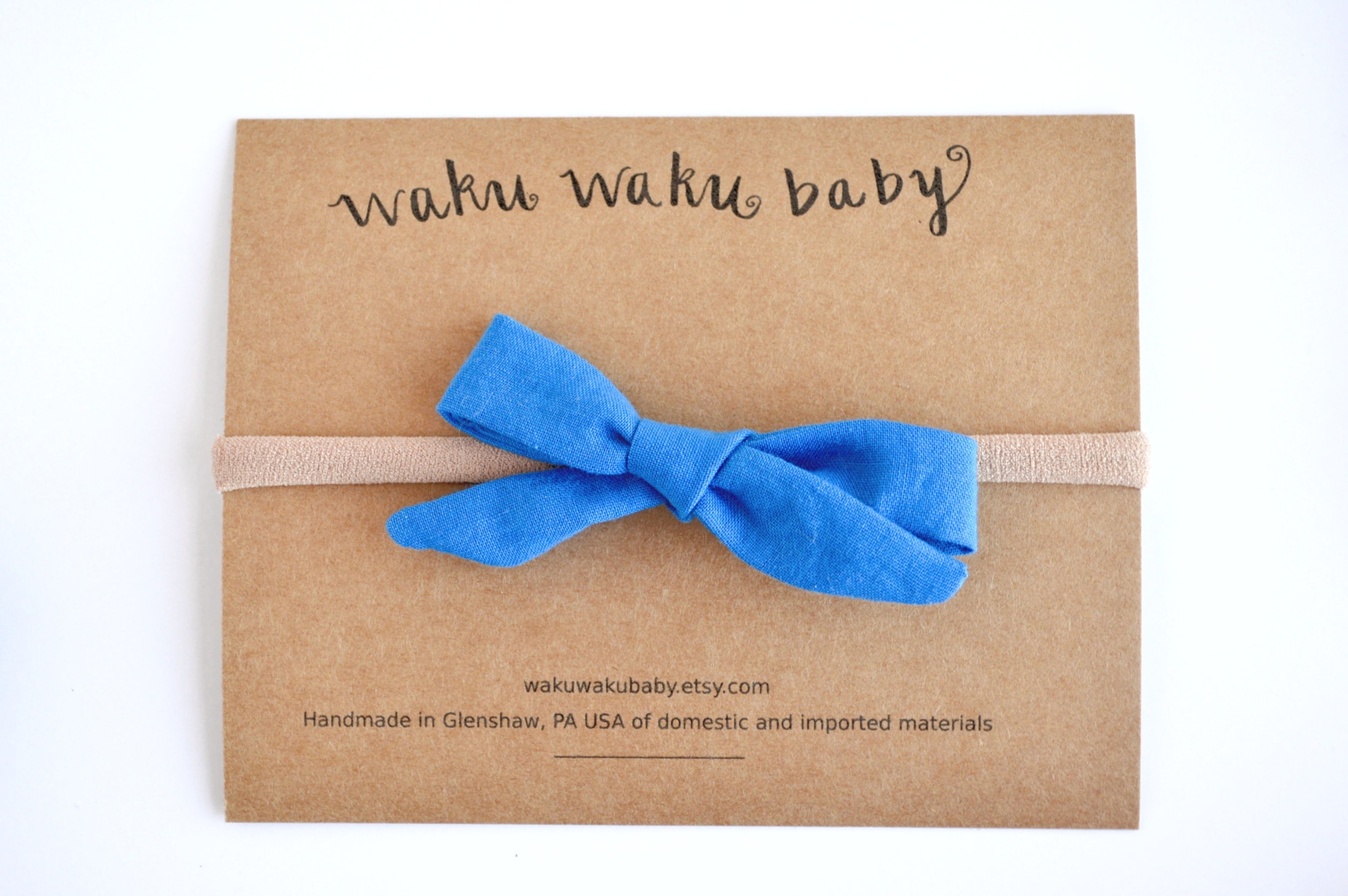 Blue school girl style hair bow on headband