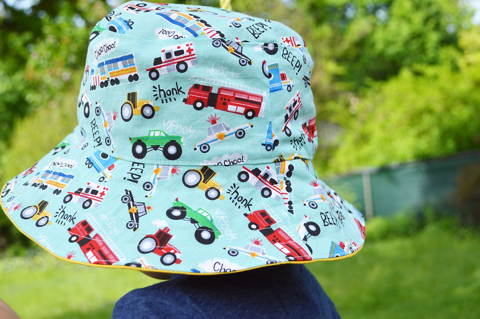 Thumbnail: bucket hat with cars and trucks on boy back view