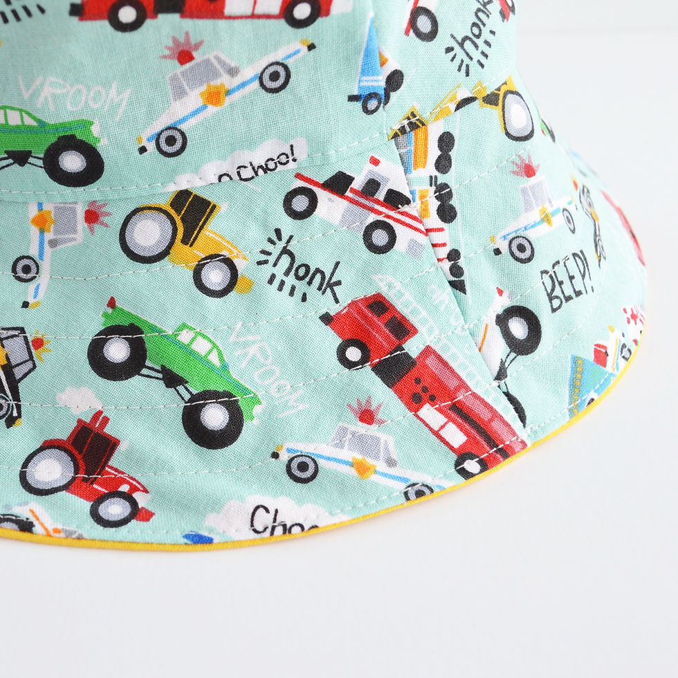 Thumbnail: bucket hat with cars and trucks close up view