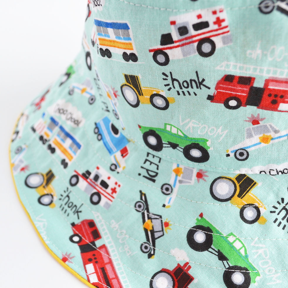 Thumbnail: bucket hat with cars and trucks close up view sideways