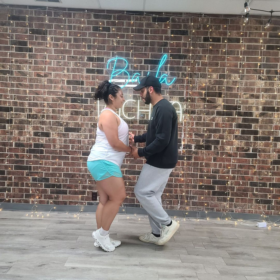 Miguel and Elisa in their dance Studio dancing Bachata