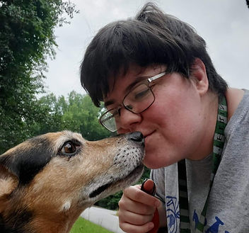 Dog walker having a snuggle moment with a clients dog