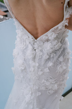 Timeless bridal gown featuring lots of tiny white flowers for a luxury Montreal wedding editorial at the Four Seasons.