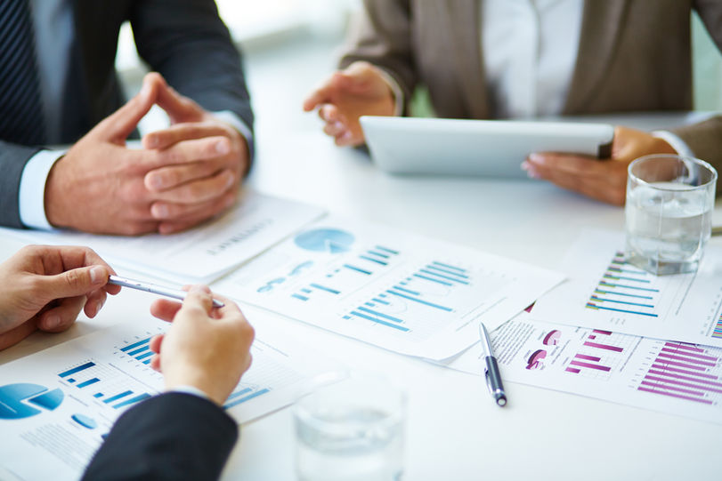 close-up-of-businesspeople-working-with-documents.jpg