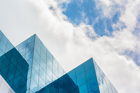top-of-skyscraper-business-building-on-blue-sky.png