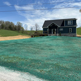Hydroseeding job to promote healthy lawn growth and prevent erosion.