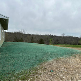 Hydroseeding job to promote healthy lawn growth and prevent erosion.