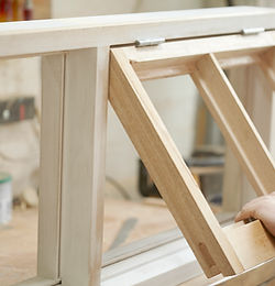Carpenter Assembling Newly Made Windows