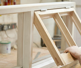 Carpenter Assembling Newly Made Windows