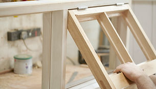 Carpenter Assembling Newly Made Windows