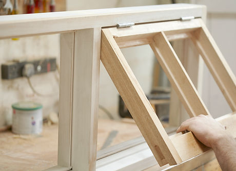 Carpenter Assembling Newly Made Windows