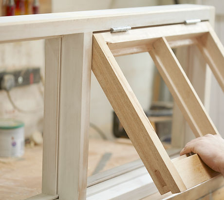 Carpenter Assembling Newly Made Windows