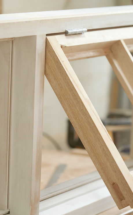 Carpenter Assembling Newly Made Windows