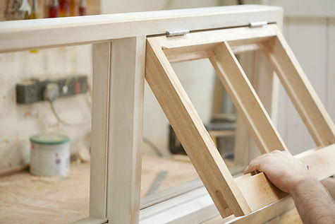 Carpenter Assembling Newly Made Windows